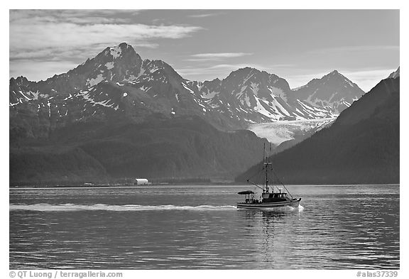 Fishing boat, mountains and glaciers. Seward, Alaska, USA (black and white)