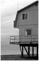 House on stilts on the Spit. Homer, Alaska, USA ( black and white)