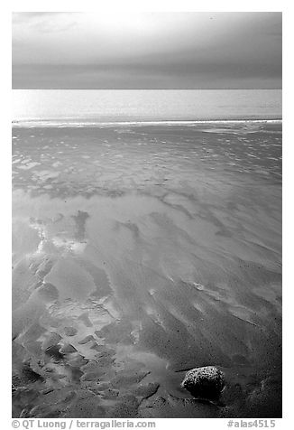 Sand patterns and stormy skies on the Bay. Homer, Alaska, USA (black and white)