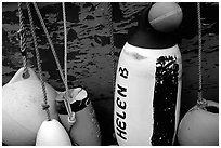 Buoys hanging on the side of a boat. Homer, Alaska, USA ( black and white)