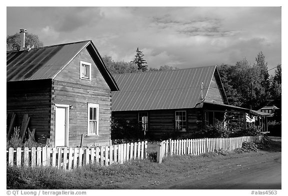 White picket fence and wooden houses. Hope,  Alaska, USA (black and white)