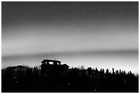 House and Northern Lights filled sky. Alaska, USA ( black and white)