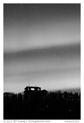 Hilltop house and Aurora Borealis. Alaska, USA (black and white)