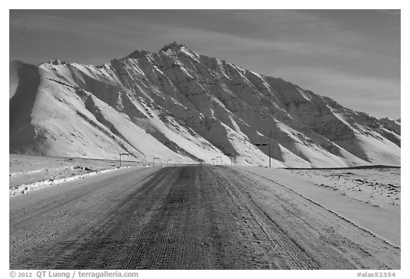 Frozen James Dalton Highway below Arctic Mountains. Alaska, USA (black and white)