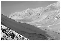 Snowy Arctic valley seen from Atigun Pass. Alaska, USA ( black and white)