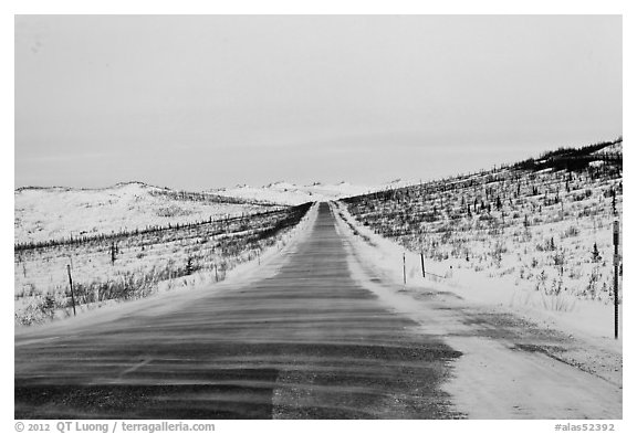 Windblown drifted snow across Dalton Highway. Alaska, USA (black and white)