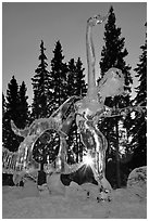 Sun setting over ice sculpture, World Ice Art Championships. Fairbanks, Alaska, USA (black and white)