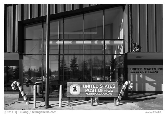 Post office sign with candy stripped canes. North Pole, Alaska, USA (black and white)