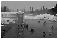 Popular outdoor hot springs, winter twilight. Chena Hot Springs, Alaska, USA ( black and white)