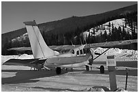 Plane on frozen runway in winter. Chena Hot Springs, Alaska, USA (black and white)