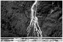 Waterfall dropping into the sea. Prince William Sound, Alaska, USA (black and white)