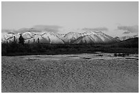 Lake with water ripples and mountains at sunset. Alaska, USA ( black and white)