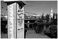 Sign showing distances to major cities on the globe in Fairbanks. Fairbanks, Alaska, USA (black and white)