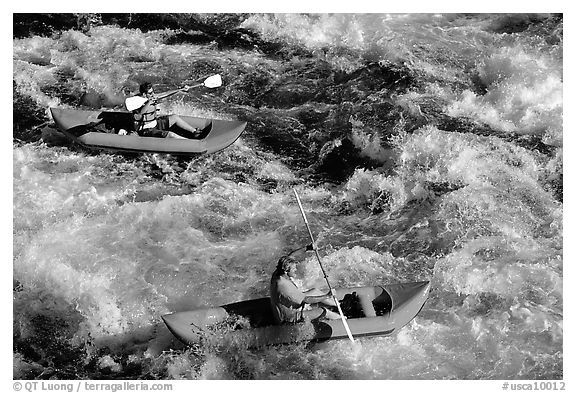 Kayakers on the rapids of the Trinity River, Shasta Trinity National Forest. California, USA