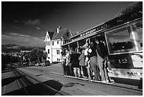 Cable car and Tudor house, Hyde Street, late afternoon. San Francisco, California, USA (black and white)