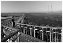 Man standing on boardwalk, Palo Alto Baylands. Palo Alto,  California, USA ( black and white)
