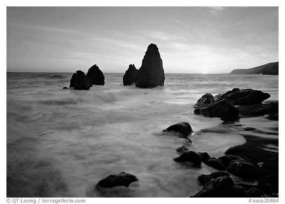Wave action, seastacks and rocks with sun setting, Rodeo Beach. California, USA (black and white)