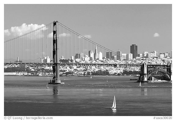 Sailboat, Golden Gate Bridge with city skyline, afternoon. San Francisco, California, USA (black and white)