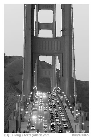 Traffic on Golden Gate Bridge at sunset. San Francisco, California, USA