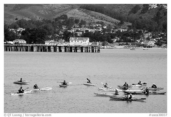 Sea kayaking in  Pillar point harbor. Half Moon Bay, California, USA (black and white)