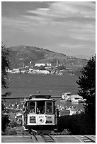 Cable car and Alcatraz Island, late afternoon. San Francisco, California, USA ( black and white)
