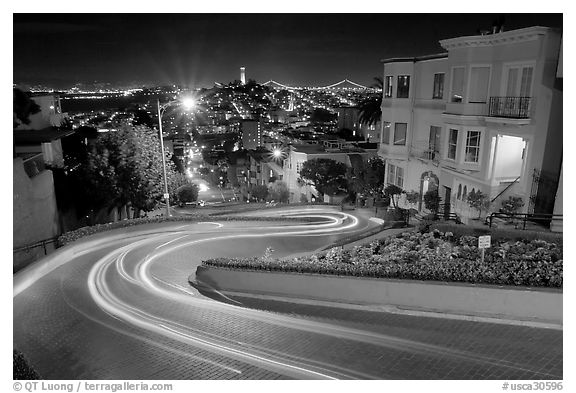 Light trails on the crooked section of Lombard Street at night. San Francisco, California, USA (black and white)