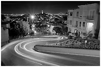 Light trails on the crooked section of Lombard Street at night. San Francisco, California, USA (black and white)