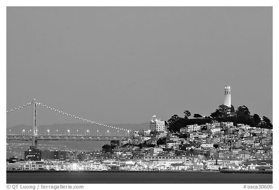 Telegraph Hill and Bay Bridge at dusk. San Francisco, California, USA