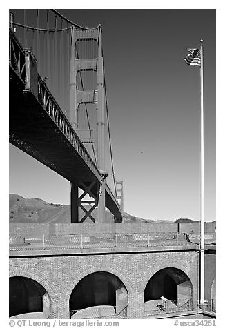 Fort Point courtyard, flag pole, and Golden Gate Bridge. San Francisco, California, USA (black and white)