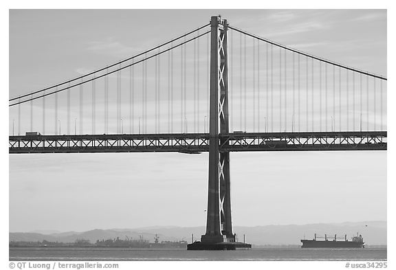 Traffic on Oakland Bay Bridge and tanker ship. San Francisco, California, USA