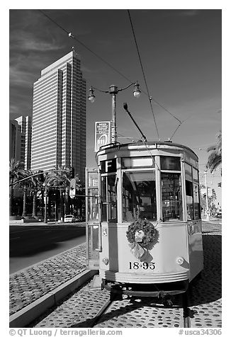 Historic trolley car and Embarcadero center building. San Francisco, California, USA (black and white)