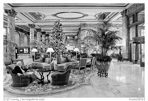 Man sitting in the lobby of the Fairmont Hotel. San Francisco, California, USA (black and white)
