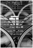 Wheels of cable winding machine in rotation. San Francisco, California, USA (black and white)