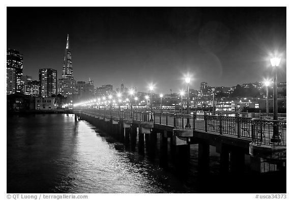 Skyline, Pier 7 lights and reflections at night. San Francisco, California, USA
