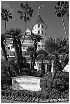 Sign, palm trees, and hotel Del Coronado. San Diego, California, USA (black and white)