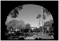 Central courtyard framed by an archway. San Juan Capistrano, Orange County, California, USA (black and white)