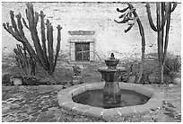 Sacred Garden, with fountain and cacti. San Juan Capistrano, Orange County, California, USA (black and white)