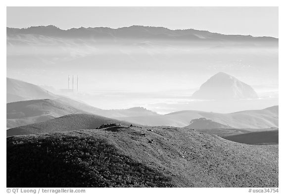 Power plant and Morro Rock seen from hills. Morro Bay, USA (black and white)
