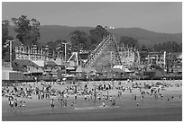Beach and boardwalk in summer, afternoon. Santa Cruz, California, USA ( black and white)