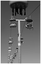 Riding the beach boardwalk aerial gondola. Santa Cruz, California, USA ( black and white)