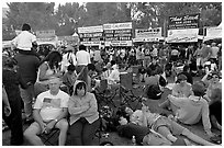 Crowd sitting on the grass in Guadalupe River Park, Independence Day. San Jose, California, USA ( black and white)
