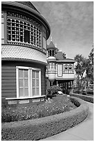 Mansion wing with door to nowhere in the background. Winchester Mystery House, San Jose, California, USA (black and white)