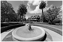 Wide view of fountain, gardens,  and mansion. Winchester Mystery House, San Jose, California, USA (black and white)