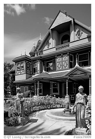 Statues, fountain, and facade. Winchester Mystery House, San Jose, California, USA (black and white)