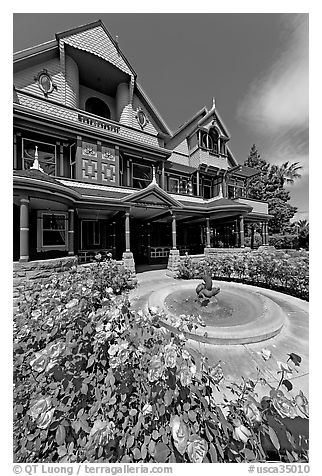 Roses and facade. Winchester Mystery House, San Jose, California, USA (black and white)