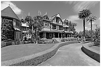 Gardens and facade. Winchester Mystery House, San Jose, California, USA ( black and white)