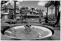 Basin, gardens and facade. Winchester Mystery House, San Jose, California, USA ( black and white)