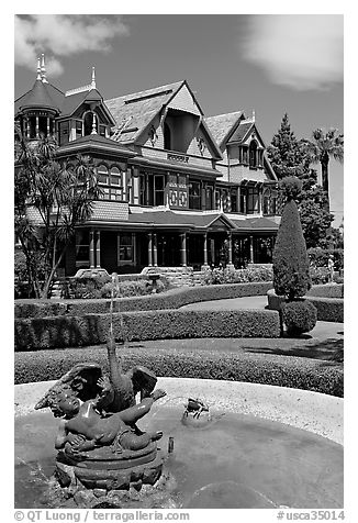 Fountain and facade. Winchester Mystery House, San Jose, California, USA (black and white)