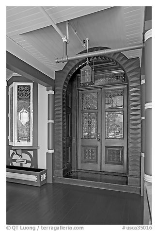 Main entrance doors, always locked. Winchester Mystery House, San Jose, California, USA (black and white)