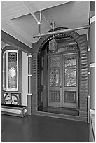 Main entrance doors, always locked. Winchester Mystery House, San Jose, California, USA (black and white)